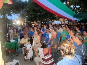Italian fans standing for the national anthem at the start of the Euro 2012 final, Monterosso, Italia
