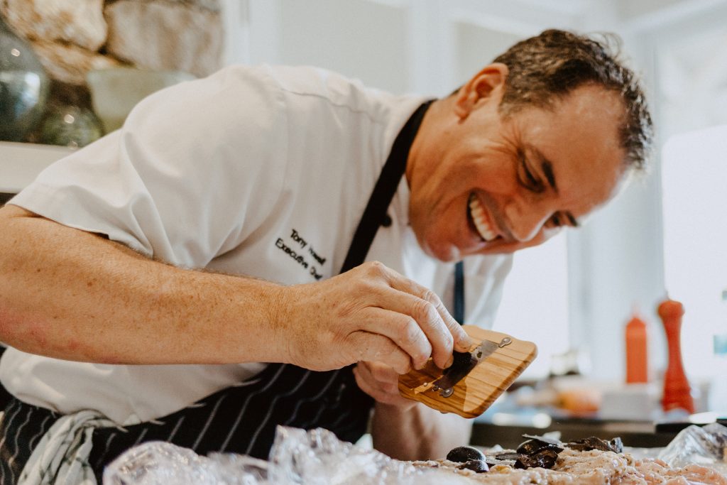 Chef Tony Howell shaving fresh truffle