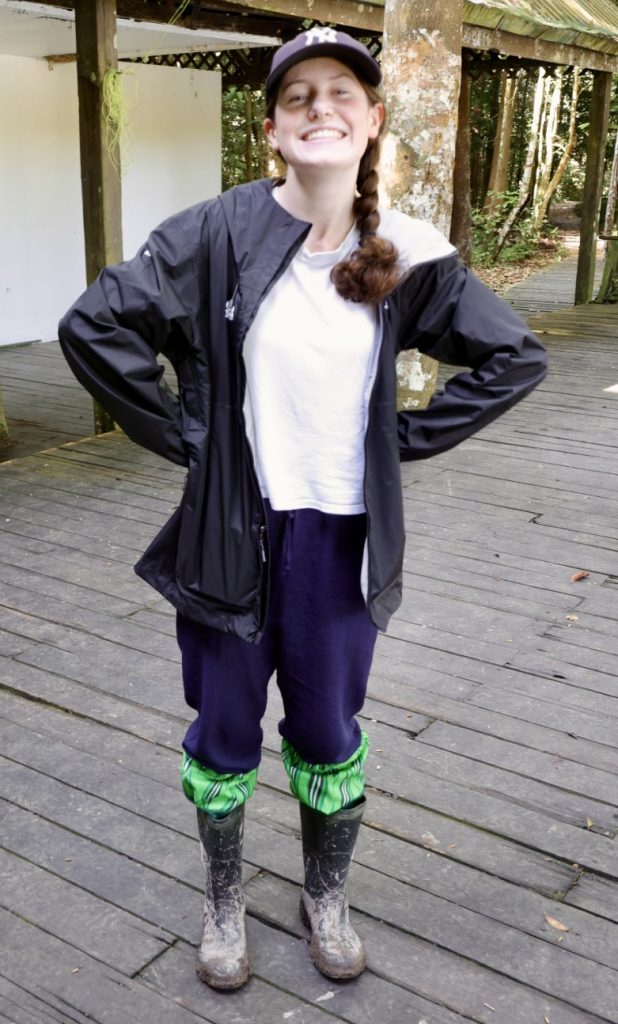 Girl in rain coat and wellington boots